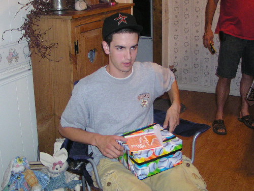 Tanner opening gifts.